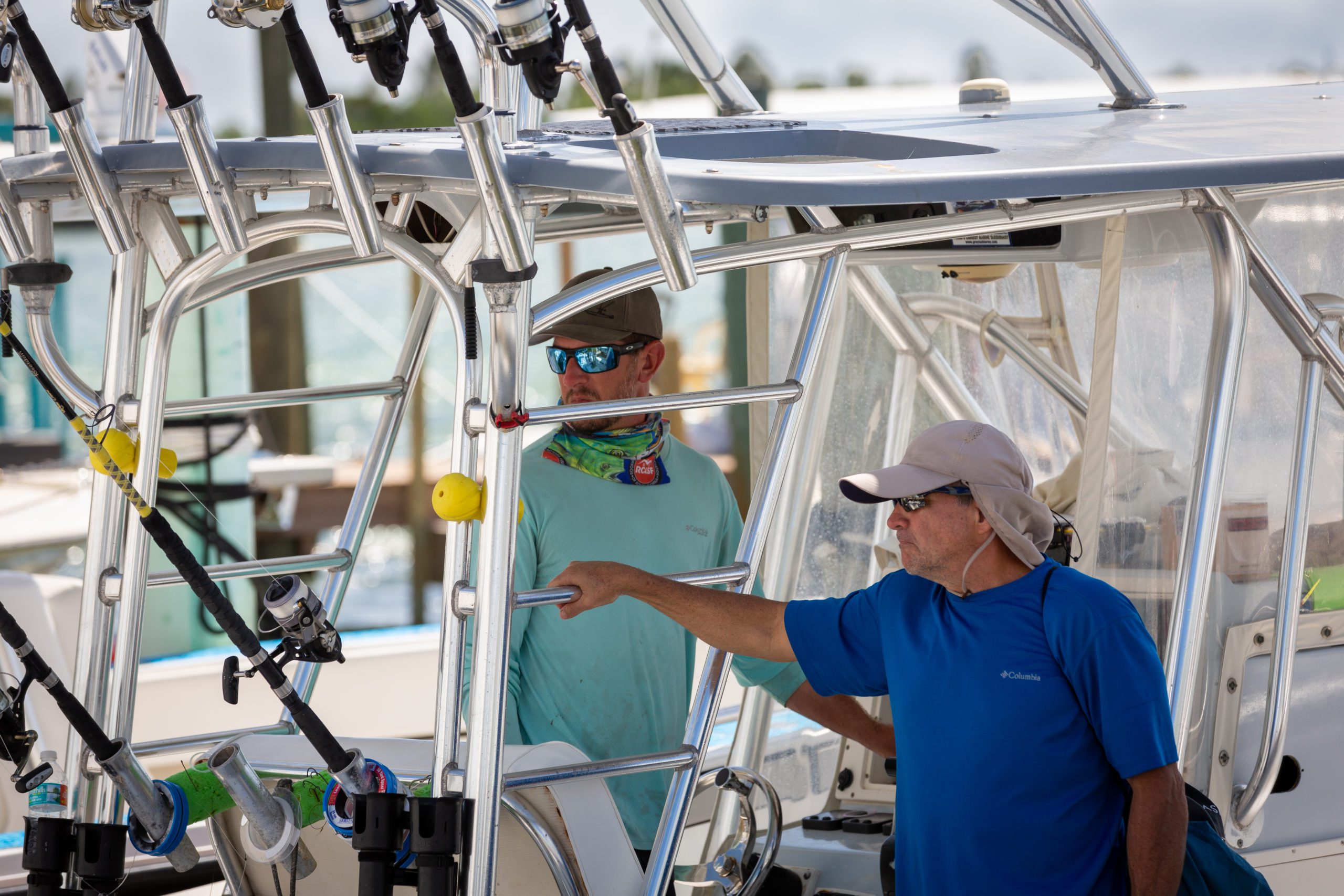 Charter fishing boat in Florida Keys marina backing in with crew